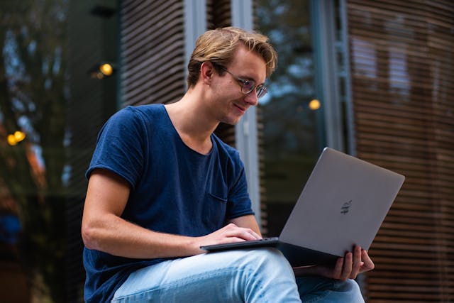 A person using a laptop.