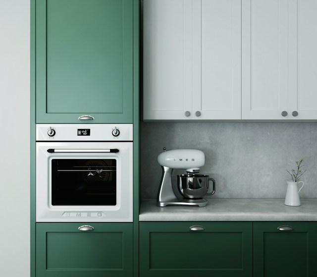 An oven and a stand mixer in a kitchen.