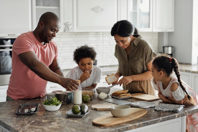 A family in a kitchen.